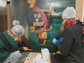 A portrait of Winston Churchill by Sir Bernard Hailstone being conserved.