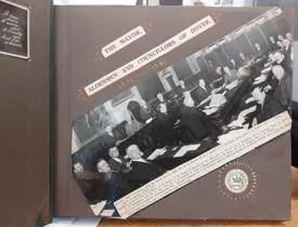 Original newspaper cutting of the photograph with text description.
