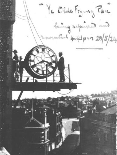 Black and white photograph of the clock, with its nicknamed Ye Olde Frying Pan